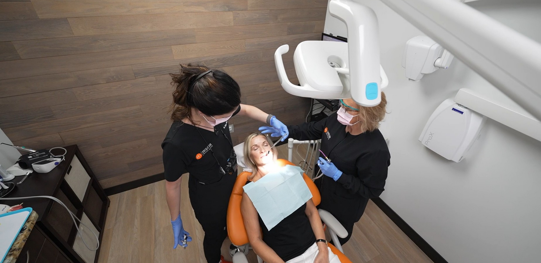 Dentist and assistant providing dental services in Minneapolis