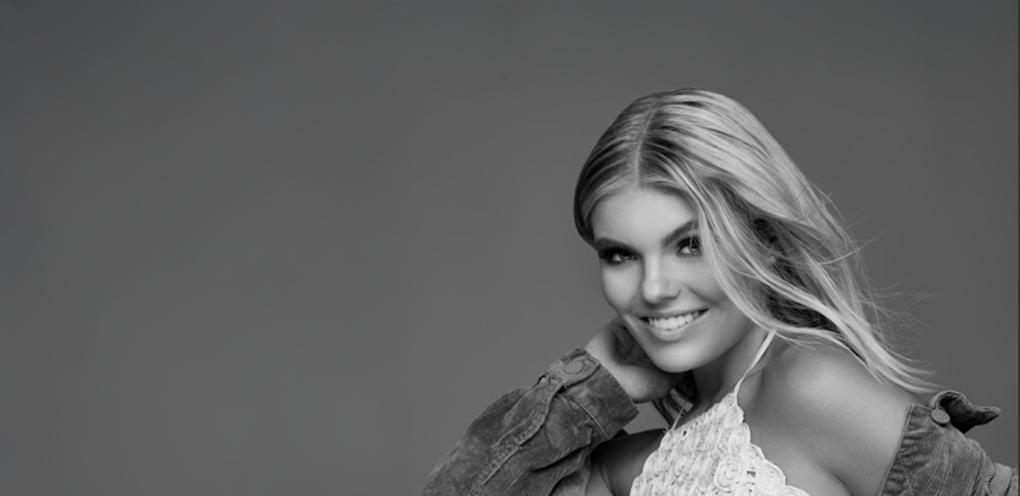 Woman smiling confidently with veneers in Minneapolis