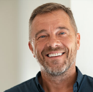 man smiling after dental bonding